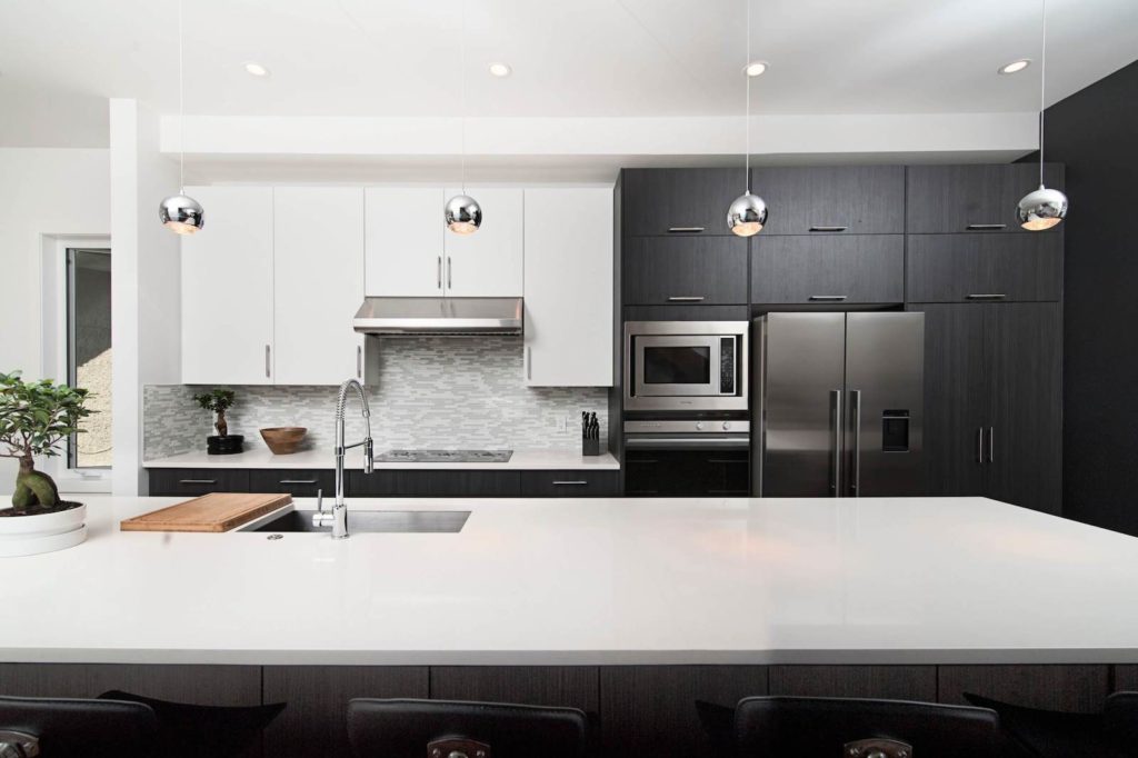 Clean white kitchen with integrated sink