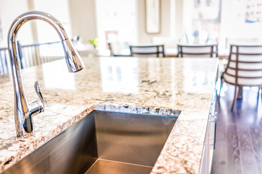 New modern faucet and kitchen room sink and granite top